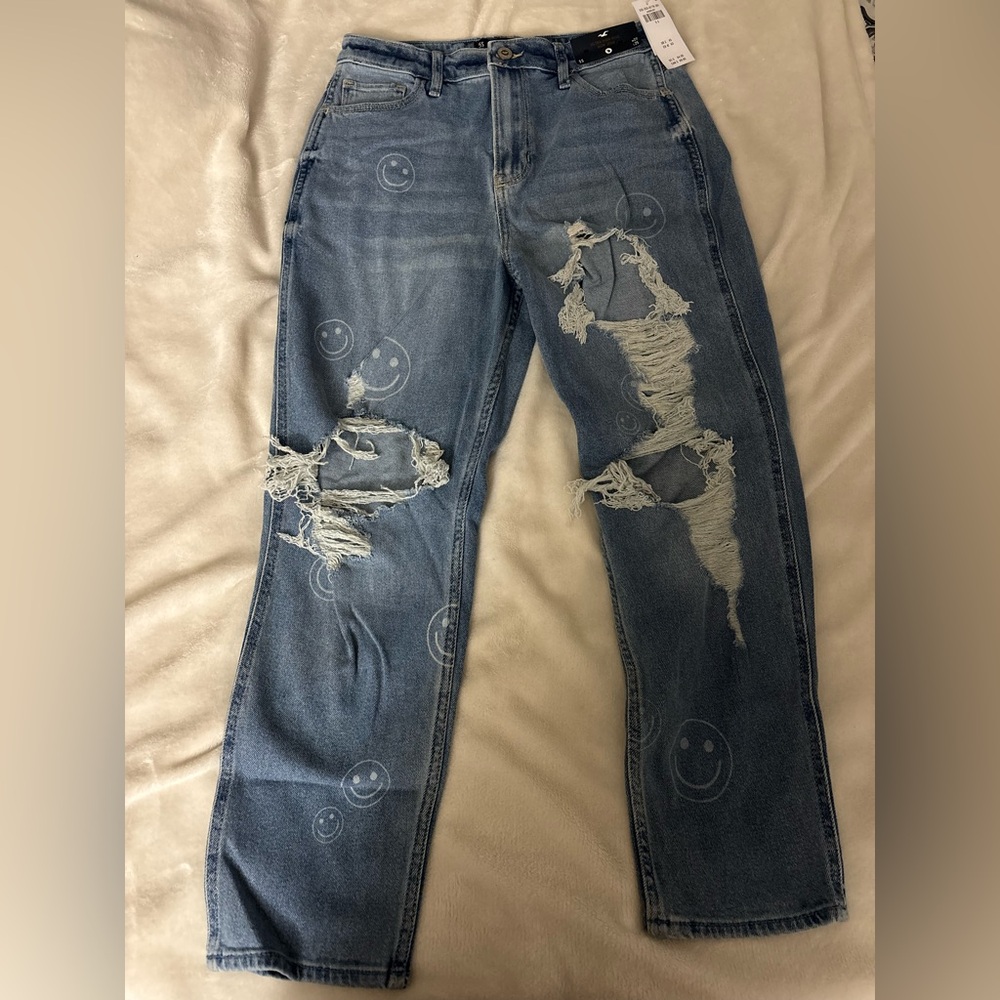 Hollister Distressed Ultra high Rise Blue Jeans with Smiley Face Design